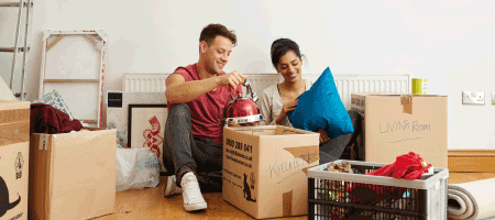 Couple moving in with boxes